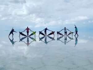 A goup of men walking on a frozen lake in Bolivia